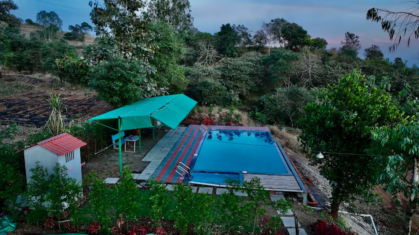 New Nisarg Resort Grounds & Pool